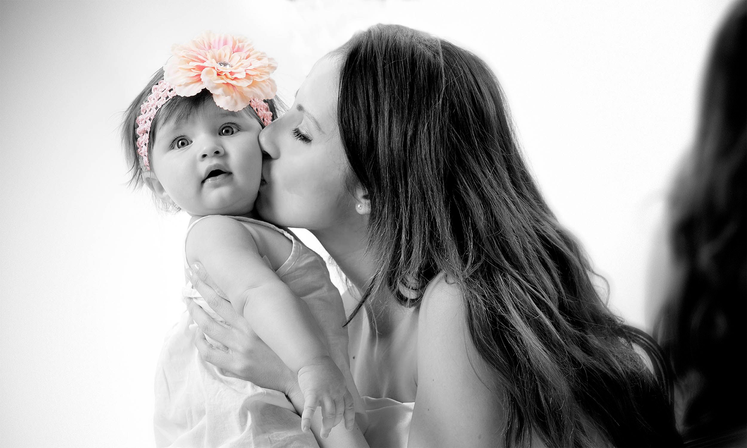 A young family photographed in black and white