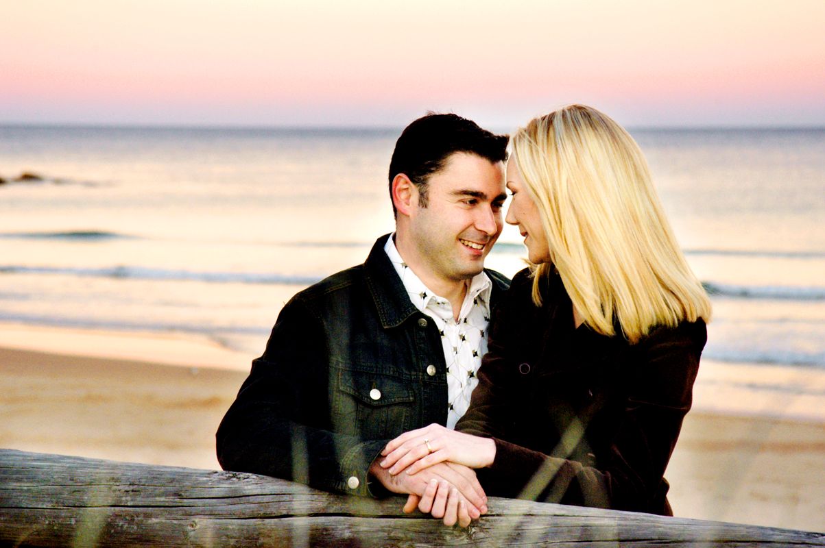 A couple embracing on the beach at sunset